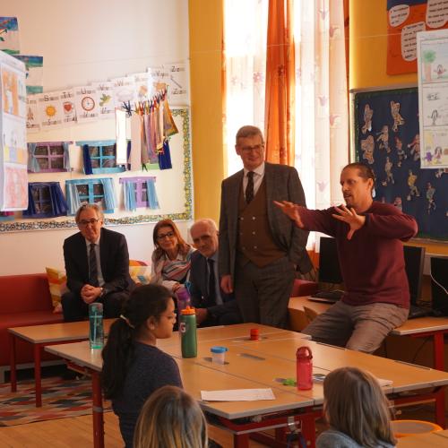 members of the delegation visiting a class at Campus Saggen